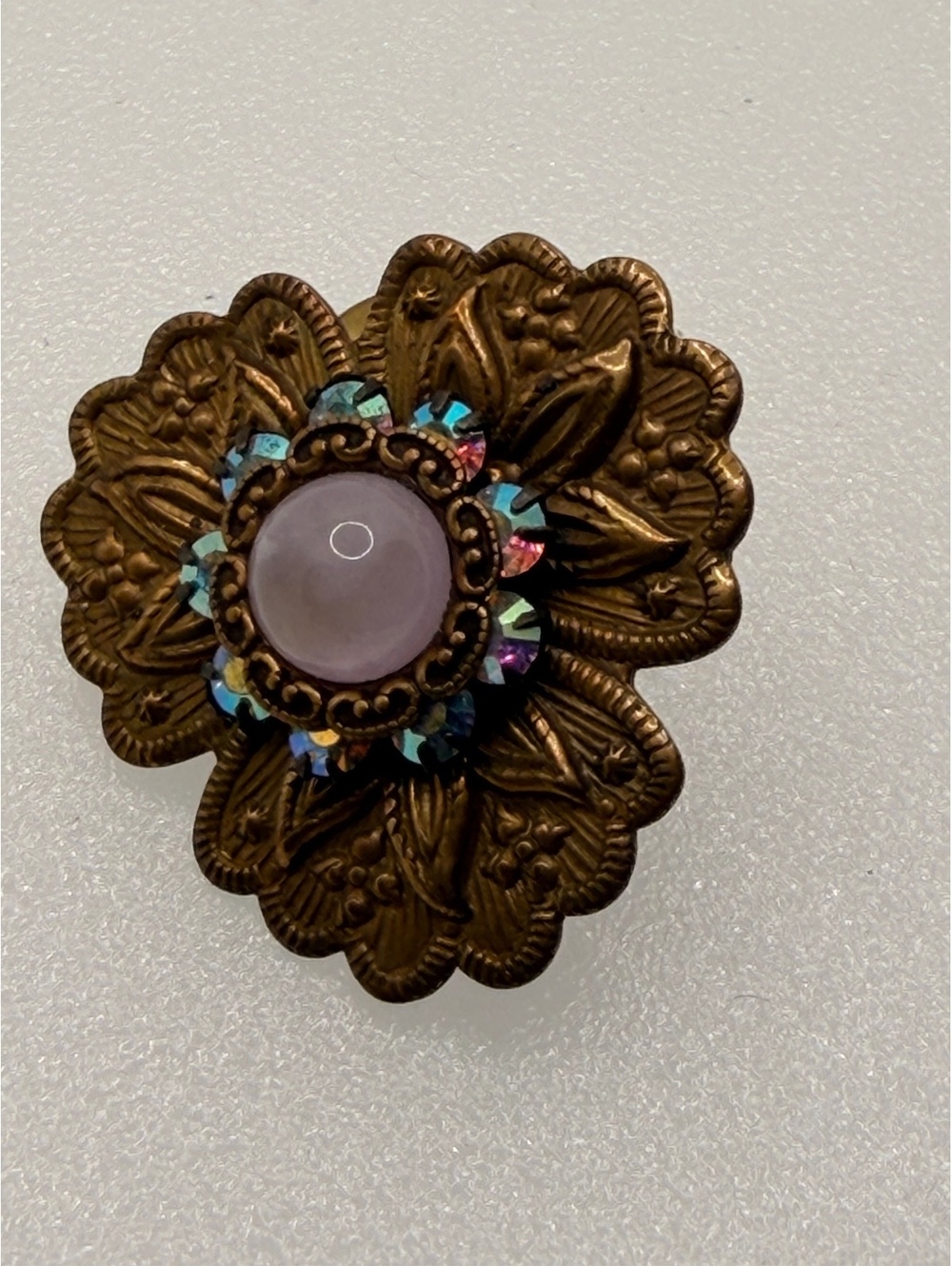 Floral brooch with pink cabochon